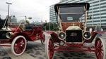 Two 1909 model t models sit outside ford headquarters in detroit during during the company's 100th anniversary celebrations